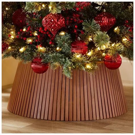 Round Wood Tree Collar | Hobby Lobby | 6164636 Square Christmas Tree Collar, Christmas Collar Tree, Christmas Tree With Collar, Wood Tree Collar, Christmas Tree Collar Ideas, Wood Slat Design, Wooden Tree Collar, Christmas Tree Collars, Tree Collar Christmas