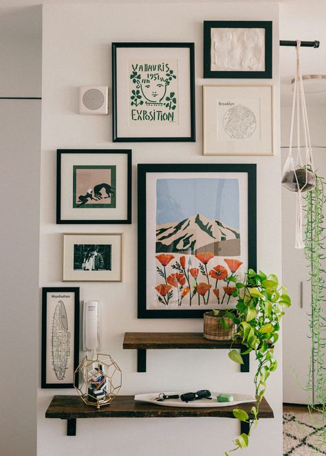 Make a statement with this easy to create gallery wall in your home! An affordable and easy update to any space... #gallerywall #statementwall #artprints #frames #gallery #entryway #nyc #apartmentstyle #bloggerhome #homedecor #interiordecorating #decor #homestyle #midcentury #modernhome #nycapartment #bloggerhome #apartment #interiorstyle #apartmenttherapy #houseplants Organize Frames On Wall, Casual Gallery Wall, Apartment Frame Decor, Natural Gallery Wall, Gallery Wall Contemporary, Decorating Small Wall Space, Mini Gallery Wall Small Spaces, Shelf And Gallery Wall, Small Wall Styling