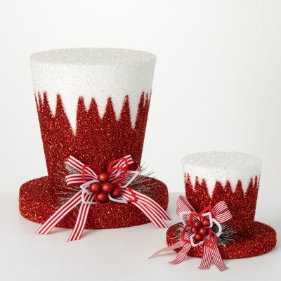 Add some fun to your holiday season with these whimsical hat tree tippers. With bold patterned ribbon and pine accents, these toppers will give your Christmas tree that perfect final touch for the holidays. | Clover Lane 2 Piece Top Hat Tree Topper Set Fabric in Red, Size 16.0 H x 15.5 W x 15.5 D in | Wayfair Diy Top Hat Tree Topper, Diy Christmas Hats, Top Hat Tree Topper, Red Top Hat, White Tinsel, Hat Tree, Gold Christmas Ornaments, Christmas Hats, Classic Christmas Tree