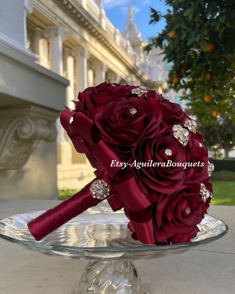 This bouquet is handmade with burgundy roses with sparkling gold brooches. The handle of the bouquet is wrapped with satin ribbon. The design can be change if requested. I can do it in different colors. Please message me if the color is not listed.  *This bouquet is 10 inches in diameter*  If you need the bouquet sooner please sent me a message.  Please contact me if you have any questions:) Thank you so much!