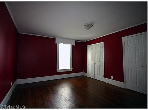 Red walls/white trim/dark wood Dark Red Bedroom Walls, Dark Red Walls Bedroom, Maroon Wall Paint, Dark Red Wall Paint, Red Walls Bedroom, Red And White Room Aesthetic, Red Wall Bedroom, Dark Red Bedroom Aesthetic, Red Wall Color