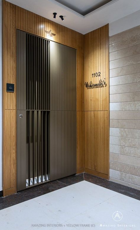 A Subtle 3BHK Apartment Complementing An Elementary Lifestyle | Amazing Interiors - The Architects Diary Entrance Paneling Design, Main Entry Gate Design, Front Door Paneling Entrance, Main Enterence Design, Entrance Door Design Apartment Modern, Entrance Door Panelling, Main Door Paneling Design Entrance, Entrance Panelling Design, Jaali Door Design