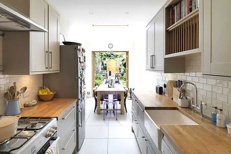 Clapham's 90 inch-wide narrow house transformed into a luxury family home | Homes and Property | Evening Standard Long Narrow Kitchen Layout, Small House Kitchen Design, Narrow Kitchen Layout, Luxury Family Home, Narrow Dining Tables, Long Narrow Kitchen, Narrow Kitchen Island, Galley Kitchen Layout, Light Wood Kitchens