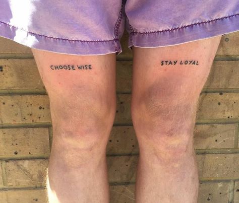 Quote Tattoo Above Knee, Leg Words Tattoos Women, Above Knee Text Tattoo, Double Word Tattoo, Knee Writing Tattoo, Knee Tattoos Words, Word Tattoos Men, Knee Word Tattoo, Above Knee Tattoo Words