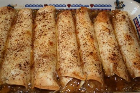 Easy Apple Pie Enchiladas -- canned pie filling rolled up in flour tortillas and covered with a buttery, brown sugar syrup and baked. Apple Enchiladas Recipe, Apple Enchiladas, Apple Pie Enchiladas, Morning Recipes, Hot Desserts, Enchilada Ingredients, Easy Apple Pie, Canned Apples, Fruit Filling