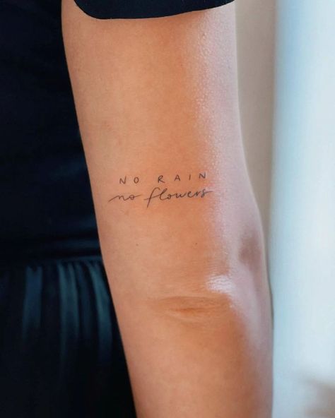 No rain 🌧️, no flowers 💐 by @there.ttt · Perpignan 🇫🇷 | Instagram No Rain No Flowers Tattoo, Above Elbow Tattoo, Inner Elbow Tattoos, Tato Minimal, Tato Jari, Tattoo Minimal, Writing Tattoos, Elbow Tattoos, Lettering Tattoo