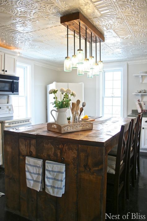 farmhouse kitchen @INDI Interiors - Nest of Bliss Tin Ceiling Kitchen, Kitchen Ceiling Tile, White Tin Ceiling, Kitchen Credenza, Trendy Farmhouse Kitchen, Exterior Light Fixtures, Farmhouse Kitchen Island, Tuscan Design, Farmhouse Light Fixtures