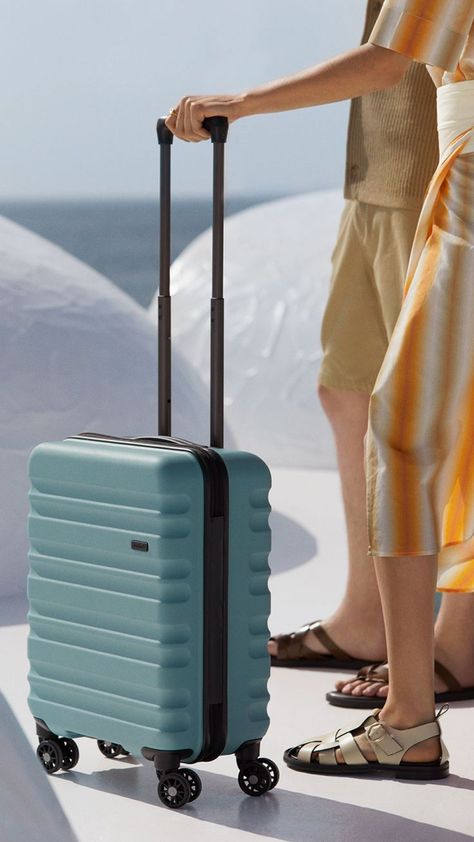 Female model stands with Antler Clifton suitcase in Mineral colourway Antler Luggage, Hard Shell Luggage, Trolley Bags, Design Posters, Style Photography, Suitcases, Graphic Design Posters, Lifestyle Photography, Metal Stamping