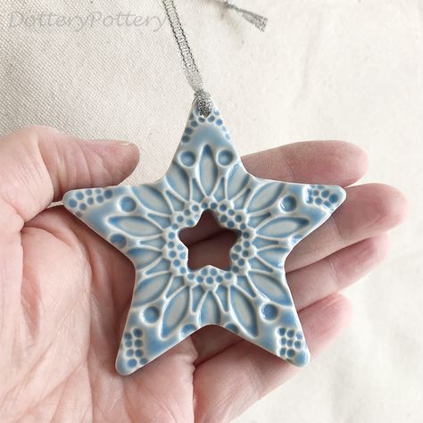 This little star is made from white earthenware clay, imprinted with pattern and finished in a bright, glossy glaze. It has been fired in an electric kiln twice, once to the bisque stage and then a second firing for the glaze. It measures 8cm wide x 7.5cm height x 1cm thick. It can be hung outside.   Copyright Dottery Pottery 2008-2022. This design has been registered and may not be reproduced. Clay Pottery Christmas Ideas, Pottery Xmas Ornaments, Christmas Clay Ideas Decoration, Ceramic Star Ornaments, Ceramics Christmas Decorations, Pottery Xmas Decorations, Air Dry Clay Christmas Ornaments Diy, Microwave Kiln Pottery, Ceramic Christmas Decor