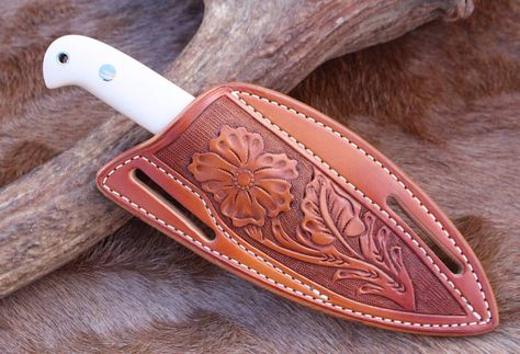 Flower carved pancake sheath. #buckaroo #buckaroostyle #cowboy #cowboystyle #westernstyle #westernlifestyle #handcrafted #handmadeleathersheath #handtooledleather #handcarvedleather #handcarvedleatherwork #customleather #customleatherwork #handmadeleatherwork #leatherwork #carvedleatherwork #tooledleatherwork Knife Sheath Pattern, Leather Holster Pattern, Cowboy Knife, Holster Pattern, Leather Knife Sheath Pattern, Leather Knife Sheath, Custom Leather Work, Cool Pocket Knives, Boot Knife