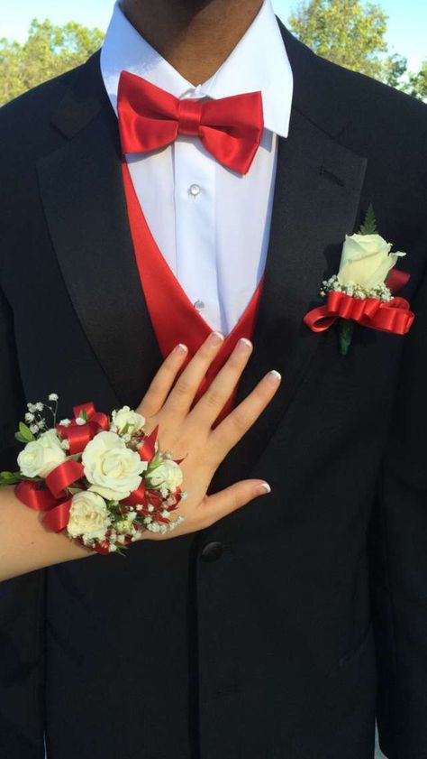 French nails/ black tux/ red vest 15 Chambelanes Suits Red, Black And Red Hoco Couple Outfits, Red Hoco Ideas, Red Prom Dress Couple Outfit, Matching Prom Couples Red, Red And Black Couple Outfits Formal, Corsages For Red Dress, Red Prom Couple Outfit Black, Red Prom Date Outfit