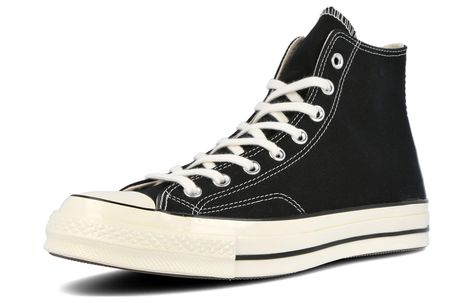 The Converse Chuck Taylor All Star 70s Hi Black takes its style cues from one of the world's oldest footwear designs. For over a century, Converse has upheld their commitment to creating iconic shoes that provide fashion-forward looks and comfortable fits for all. This premium design is just as classic, but with updated fittings attached for durability and strength so you can wear it for years to come. Crafted with double-ply canvas upper and quality stitching, the 70s Hi Black has everything yo Iconic Shoes, Spring Fashion Casual, Converse Chuck 70, Chuck 70, Converse Chuck Taylor All Star, Converse Chuck, Chuck Taylor All Star, Premium Design, Blue Shoes