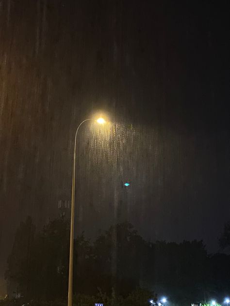 Raining in the city at night, lamp in the rain Rain At Night, Rain Street, City Rain, Rainy Sky, Rain And Thunderstorms, Rain Pictures, Rainy City, Rainy Day Aesthetic, I Love Rain