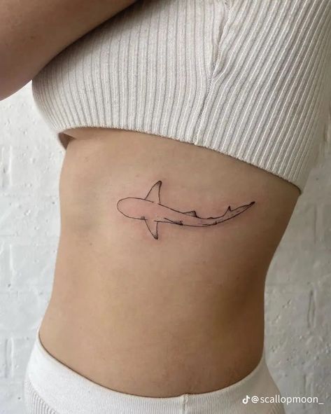 High Hip Tattoos Women, Shark Tattoos Minimalist, Aesthetic Beachy Tattoos, Stingray Back Tattoo Women, Rib Shark Tattoo, Sand Shark Tattoo, Shark Tattoo On Ribs, Shark Tattoo Hip, Cute Shark Tattoos For Women