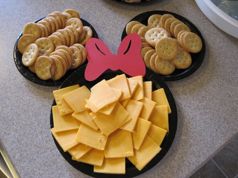 Mickey Mouse-shaped cheese (use cookie cutter) & Ritz crackers. cheese leftover from around the cut portion can be used on top of hamburgers Mickey Mouse Themed Snacks, Disney Finger Foods, Mickey Party Food Ideas, Minnie Mouse Marshmallow Pops, Mickey Mouse Theme Food, Mickey Mouse Veggie Tray, Mickey Mouse Clubhouse Birthday Party Food, Mickey Food Ideas, Mickey Mouse Snacks For Party