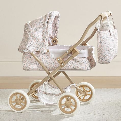 Outings with their precious cargo get a pretty upgrade with this adorable doll pram. The sturdy iron design is set on rolling wheels and features an intricate filigree fabric and matching bag for strolling in style. DETAILS THAT MATTER Made of plastic and metal. Handle is made of iron tube. Fabric is made of 100% polyester print. Wheels are made of foam. Wheels swivel. Stroller is foldable. KEY PRODUCT POINTS Pottery Barn Kids exclusive. Recommended for ages 3 and older. Wipe clean. Imported. SAFETY INFORMATION WARNING: CHOKING HAZARD - Click for details. Filigree Fabric, Reborn Accessories, Doll Pram, Convertible Stroller, Dog Accesories, Newborn Mom, Iron Design, Dolls Prams