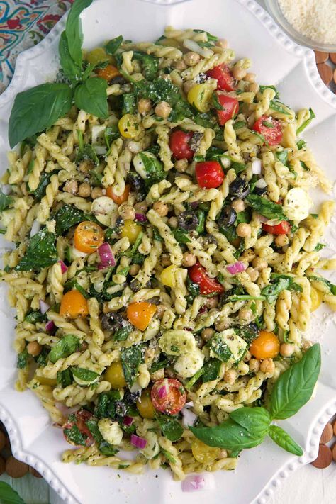 Easy Pesto Pasta Salad is the perfect dish for picnics, or a light lunch. This vibrant salad combines pasta, juicy tomatoes and basil pesto. Easy Veggie Pasta Salad, Cypress Pasta Salad, Basil Side Dish Recipes, Packed Lunch Salad Ideas, Easy Pesto Meals, Pesto Pasta Salad With Peas, Pasta Salad Summer Cold, Easy Vegetarian Pasta Salad, Amazing Pasta Salad