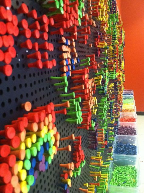 Contribute Your Creativity to a Tee is a exhibit by artist Danny Murphy Using colorful golf tees and a giant pegboard, Contribute Your Creativity to a Tee encourages visitors to make there own designs in this constantly changing display. Make your own design or just watch how the wall changes with a giant movable pattern wall created by artist Danny Murphy. Maker Fun Factory Vbs, Maker Fun Factory, Collaborative Art Projects, Interactive Walls, Fence Art, Interactive Art, Viria, Collaborative Art, Golf Tees