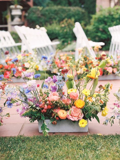 40 Wildflower Wedding Decor Ideas For Your Big Day How To Make Aisle Flowers, Diy Flower Arrangements Wedding Arch, Wildflower Aisle Decor, Wildflower Wedding Aisle Decorations, Square Arbor Wedding, Colorful Wedding Ceremony Decor, Wedding Florals Aisle, Ground Flowers Wedding, Wildflower Aisle Wedding