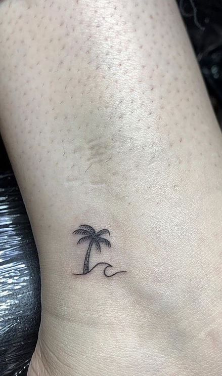 Tattoo To Get On Holiday, Palm Ankle Tattoo, Beach Tree Tattoo, Palm And Pine Tree Tattoo, Palm Tree Water Tattoo, Palm Tree Henna Tattoo, Wave Tattoo With Palm Tree, Palm Tree Wave Tattoo Ankle, Palm Tree Tiny Tattoo