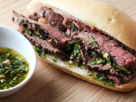 Broiled skirt steak, bread, and chimichurri sauce is really all you need for this simple sandwich—you'll find yourself plunging the sandwich into the chimichurri before every bite. Skirt Steak Sandwich Recipes, Chimichurri Steak Sandwich, Ribeye Steak Sandwich Recipes, Chimichurri Sandwich, Steak And Chimichurri, Chimichurri Steak, Broiled Steak, Steak Sandwich Recipes, Recipes Meat