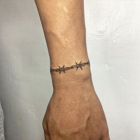 Resh Tattoo on Instagram: "Wrist barb wire band. ⛓️  #wristtattoo  #bandtattoo #barbwire #inked #tattoo" Wrist Tattoos Barbed Wire, Tattoo Wire Barbed, Barb Wire Bracelet Tattoo, Barbed Wire Tattoo Forearm, Barb Wire Elbow Tattoo, Barbwire Bracelet Tattoo, Barbed Wire Band Tattoo, Barbed Wire Tattoo Sleeve, Small Barbed Wire Tattoo