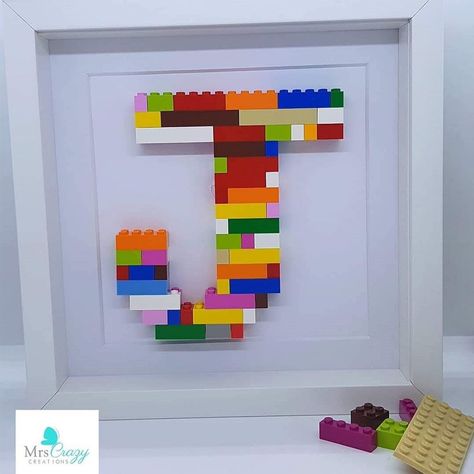 Your very own Letter made from original LEGO® Bricks, a unique keepsake for any bedroom or playroom. Just select your letter and we will expertly select all the brightest lego bricks and create your original artwork. The perfect gift for any new baby or maybe for a childhood LEGO® loving grown up! Comes presented in a white box frame ready to be hung or propped on a shelf. Made from genuine lego bricks Delivery We use secure and professional packaging for every product to ensure your item reache Lego Name Plate, Lego Home Decor Ideas, Boys Lego Bedroom Ideas, Lego Bedroom Ideas Boys, Lego Rooms For Boys, Boys Lego Bedroom, Lego Bedroom Decor, River Bedroom, Lego Themed Bedroom