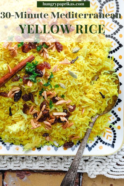 Platter with yellow rice and serving spoon Caption reads: 30 Minute Mediterranean Yellow Rice Mediterranean Yellow Rice, Hungry Paprikas, Chicken Broth Substitute, Mediterranean Rice, Paprika Recipes, Middle Eastern Salads, Impressive Dinner, Whole Spices, Rice Varieties