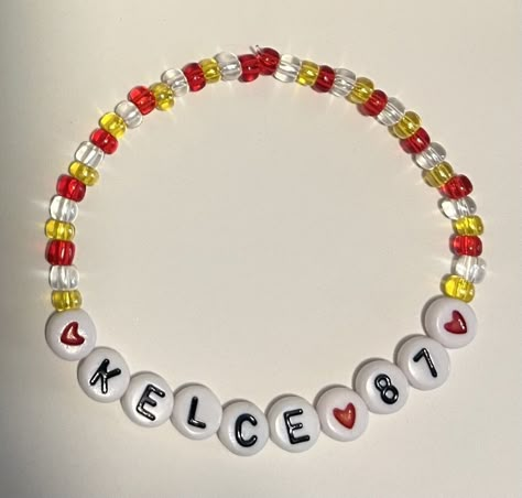 Kelce 87 bracelet as pictured! One size fits most-made with stretchy band. Made with glass beads! Travis Kelce Bracelet, Chiefs Bracelet Ideas, Swifty Bracelets, Concert Bracelets, Taylor Bracelets, Taylor Bracelet, Taylor Swift Friendship Bracelet, Eras Bracelets, Swift Bracelet