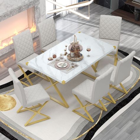 PRICES MAY VARY. 🏡 [7-Piece Modern Dining Table Set] This 7-piece dining table set has a modern minimalist style. The streamlined table is matched with 6 beautiful PU leather upholstered chairs, which can makes them seamlessly integrated with various design styles schemes. The matching scheme of gold and white increases the visual attraction of the space. The dining room set provids a fashionable and practical space for dining, gathering or working. 🏡 [Rectangular Marble Texture Kitchen Table Modern Dining Table Set, White Dining Room, Dining Furniture Sets, Leather Chairs, 7 Piece Dining Set, Dining Table Set, Marble Texture, Dining Room Bar, Modern Dining Table