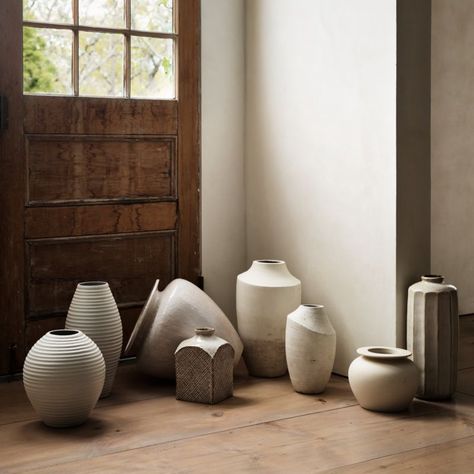 Historical Japanese ceramic works inspired our Nikko collection, which updates classical silhouettes with modern finishes. Cast and glazed by hand, this terracotta mini planter is coated with a white reactive volcanic glaze that textures its curves and angles. Popped in a plant in a nursery pot for an instant upgrade or used as a vase, the planter pairs with our Nikko vases in a graceful group.     Handcast, -trimmed, -sponged, -glazed and -decorated  Terracotta  Reactive volcanic glaze  No drai Ceramic Vase Ideas, Ceramic Photography, Terracotta Vases, Textured Vase, Large Ceramic Vase, White Ceramic Planter, White Ceramic Vase, Wilson Art, Organic Ceramics