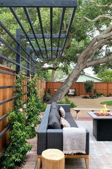 From the perfect space heaters to warm things up to the best decor to create that cozy vibe, here are 15 winter patio ideas that will make your outdoor area a delightful place that you actually want to spend time in, even when it's cold outside. #hunkerhome #winterpatioideas #patioideas #patio #patiodecorideas Privacy Fence With Pergola Top, Exterior Home Walkways, Trellis Pergola Ideas, Trellis Patio Cover, Oklahoma Backyard Landscaping, Modern Yard Design, Gorgeous Backyards, Cantilevered Pergola, Pergola Build