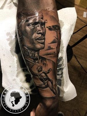 20 Powerful Africa Tattoos | Tattoodo Sankofa Tattoo, African Warrior Tattoos, African Sleeve Tattoo, Dark Skin Tattoo, Black Men Tattoos, African Warrior, Africa Tattoos, Chicanas Tattoo, Zulu Warrior