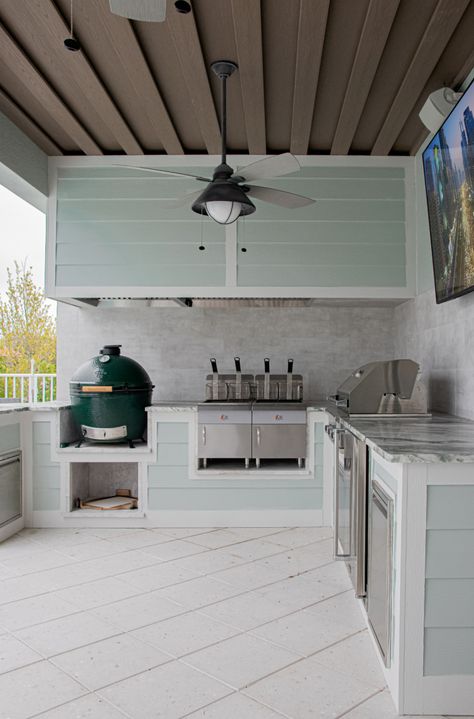 Redesign your outdoor cooking space - a functional design so you can get the most out of your summer kitchen. #biggreenegg #builtingrill #bbqarea #outdoorkitchen #outdoorlivingspace Modern Coastal Outdoor Kitchen, Hardie Board Outdoor Kitchen, Outdoor Kitchen Hardie Board, Southern Outdoor Kitchen, Outdoor Kitchen Wall Ideas, Shiplap Outdoor Kitchen, Coastal Outdoor Kitchen, Outdoor Kitchen Backsplash, Florida Outdoor Kitchen