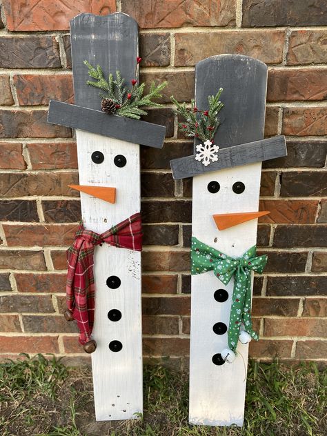 "These wooden snowmen yard or porch decorations are made using reclaimed wood and painted white with white wash effect. These are sold separately but can be purchased as a set. The snowman has a red checkered scarf and the snow woman has a green scarf. These can be propped up or can be purchased with hardware. That would include the metal brackets as well as the metal post.  Measurements: 34.5\"x5\" 34\"x5.5\" These are individuals and can be placed close to each other or apart. Due to the nature of using reclaimed wood, we can not guarantee each snowman will look the same as the picture. We will do our best to ensure that they match.  More in our shop: Decorative tray: https://www.etsy.com/listing/1522192427/14-custom-decorative-tray-gift-for-her Decorative Christmas books: https://little Reclaimed Wood Christmas Decor, Christmas Signs Wood Front Porches, Snowmen Decor, Front Porch Decorations, Outdoor Snowman, Christmas Diy Wood, Wood Yard Art, Wooden Snowmen, Wooden Christmas Crafts