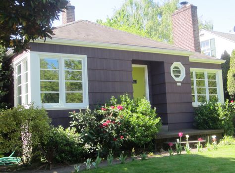 Here, the green door cheerfully pops out of the luscious surroundings. The window trims were left white in accordance with the vinyl windows. Eggplant House Exterior, Purple House Exterior, Outside House Paint, Paint Colors For House, Colors For House, Purple House, Aubergine Color, Best Exterior Paint, House Paint Color Combination