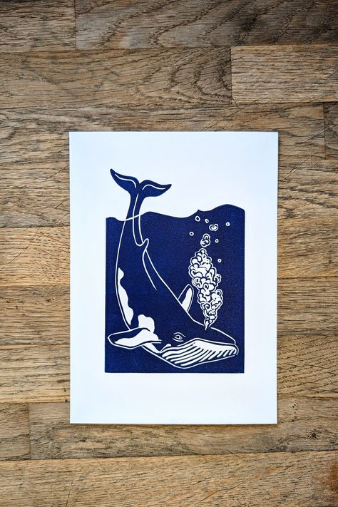 Hand printed Minke Whale art print. Dark blue ink on A5 (21x14.8cm) white card, print size A6 (14.8x10.5cm), sold unframed and unmounted. All designs are carved in lino and hand printed individually. For this reason there will be slight variations in the finish of each item, which is all part of the beauty of a handmade card.  About the Little Blue Printing Co.  Started in 2020 from my little blue cottage on the Essex-Suffolk border.  All items are made by hand and are recyclable as well as being made where possible from recycled materials.  All orders are sent plastic-free. Head to my Instagram to see more of how my prints are made: https://instagram.com/littleblueprinting.co?igshid=YmMyMTA2M2Y= Whale Cards Handmade, Lino Print Art, Whale Art Print, Minke Whale, Mermaid Christmas, Blue Cottage, Batik Art, Whale Art, Linocut Art