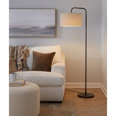 Slender and streamlined, this floor lamp brings a touch of contemporary style as it illuminates any space in your home. Founded atop a round base, this metal fixture features an arched body that props up a single light, while a hardback drum shade up above completes the understated design and diffuses its brightness. Some assembly is required, and this luminary does not include a compatible 100W incandescent bulb. Langley Street® Shade Color: Natural Linen, Finish: Oil Rubbed Bronze | Langley St Tripod Floor Lamp Living Rooms, Dining Room Floor Lamp, Standing Lamp Living Room, Pole Lamps, Tall Floor Lamps, Stylish Floor Lamp, Corner Lamp, Industrial Floor Lamps, Tall Lamps