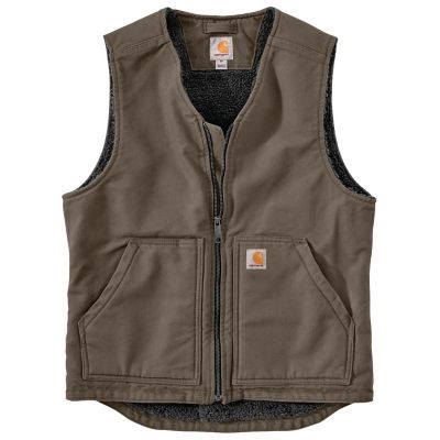 The Carhartt Men's Washed Duck Sherpa-Lined Vest is a versatile layer built to pack on extra warmth right where it matters most. The men's sherpa-lined vest is made of our signature heavyweight cotton duck, and has a warm Sherpa lining to take on chilly weather. This sherpa-lined vest is the perfect addition to any outfit. Made with 12 oz. 100% ringspun cotton washed duck for comfort Triple-stitched main seams for durability Two sherpa-lined front pockets and two inner pockets Sherpa-fleece lining for added warmth Full center-front zipper for easy on and off Sherpa-lined vest with droptail hem for a unique look Imported Carhartt Vest, Vest For Men, Weighted Vest, Mens Sherpa, Sherpa Vest, Collar Vest, Big Clothes, Tractor Supply, Outerwear Vest