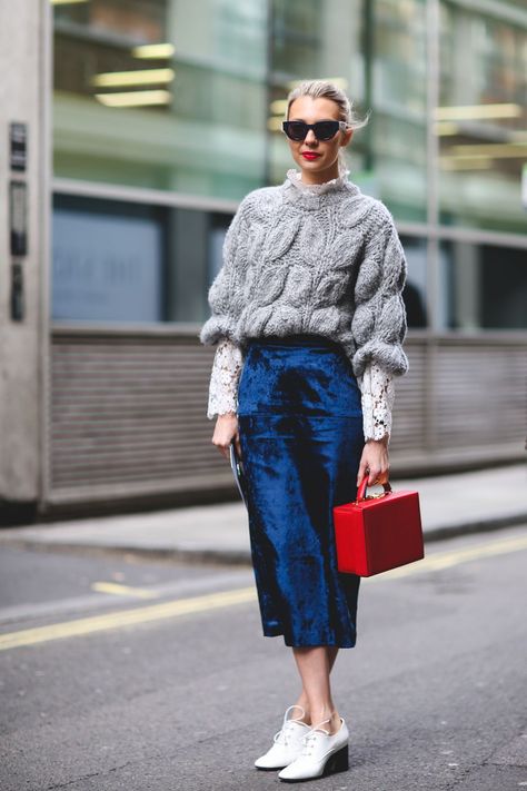 New Ways To Wear Clothes You Were About To Retire #refinery29  http://www.refinery29.com/unexpected-street-style-styling-tips#slide-9  Spruce up a chunky knit that's seen better days with a pretty lace top underneath and a fancier velvet skirt.... Velvet Skirt Outfit, London Fashion Week Street Style, London Fashion Weeks, Rock Outfit, Velvet Clothes, Red Bag, London Street Style, Looks Street Style, The Best Street Style