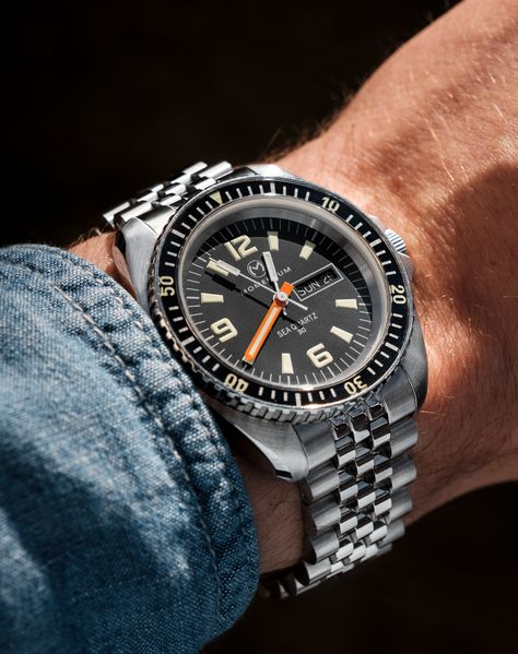 Before starting Momentum, our founder Simon and his family owned a watch company called Chronosport. In 1977, they launched one of the first-ever analog quartz diver’s watches, the Sea Quartz 30. The brand became so popular that it was soon sold in almost every serious dive store in the US and Canada. This watch was also famously worn by Tom Selleck in the first 3 seasons of the hit show Magnum PI.For many brands, quartz dive watches are an afterthought. We are proud of our quartz watches and be Seiko Mod, Magnum Pi, Field Watches, Tom Selleck, Retro Watches, Black Crown, Amazing Watches, Watch Companies, Perforated Leather