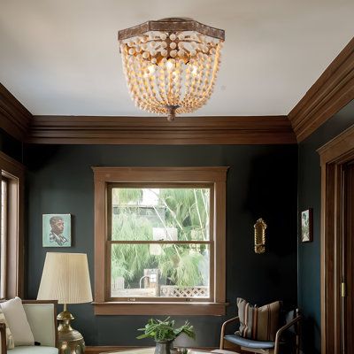 Add a touch of antique style to the decor of your modern home with the wood Bead Semi-Flushmount . The worn frame contains distinct, graceful curves and attaches a series of beads that flow downward and inward, connecting to a central pillar below. A set of four bulbs rest within, emitting a warm layer of light that accents with the beads as it spreads into the room. | Dakota Fields Chemise Wood Semi Flush Mount 16.1 H x 17.7 W x 17.7 D in brown / gray in Antique Copper | 16.1" H X 17.7" W X 17. Wood Ceiling Dark Walls, Exposed Wood Trim, Victorian Home Lighting, Dark Painted Shiplap Walls, Colonial Revival House Interior, Gothic Farmhouse Living Room, Wall Colors With Wood Trim, Light Academia House, Tudor Style Cottage