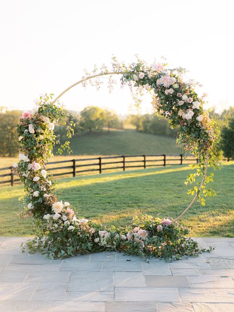 A lush green & pastel floral arch that matches the magical scenery perfectly | wedding flowers,flowers for wedding,floral wedding,flower arrangements,floral installation,floral inspiration,event floral design,floral details,wedding flowers,wedding ceremony,wedding ceremony decoration,wedding ceremony decor ideas,elegant wedding,wedding details,wedding decorations,elegant wedding decro ideas,wedding planning,wedding stylist,wedding florist,outdoor wedding,outdoor wedding ceremony,2022 wedding Flowers Wedding Ceremony, Wedding Arches Outdoors, Floral Archway, Wedding Arbors, Wedding Alters, Floral Arch Wedding, Floral Installation, Wedding Ceremony Arch, Wedding Arch Flowers