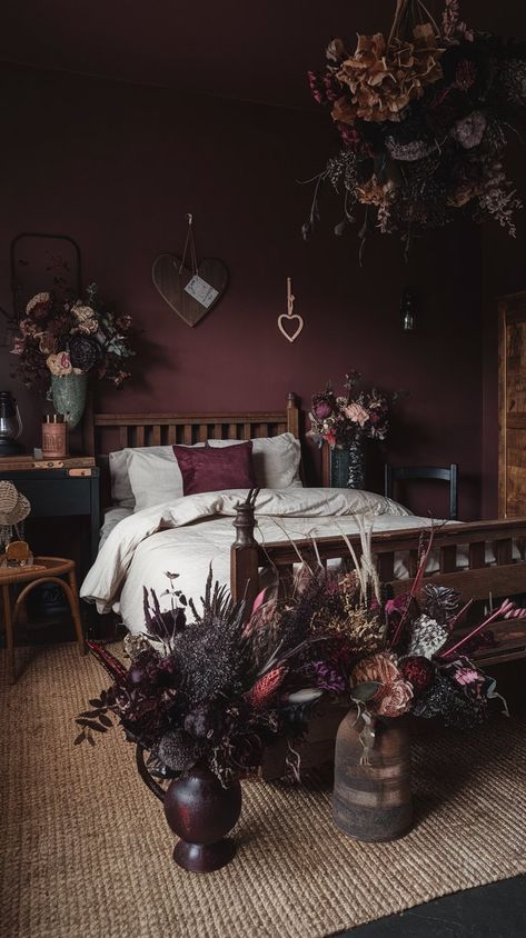 Discover how to transform your bedroom with dark cottagecore decor. Explore textures, colors, and furniture that embody this enchanting, moody aesthetic. Dark Garden Bedroom Aesthetic, Dark Plum Wall Color, Dark Green And Burgundy Bedroom, Dark Wall Room Ideas, Red And Navy Bedroom, Witchy Maximalist Bedroom, Dark Earth Tones Aesthetic, Witchy Wall Colors, Deep Plum Bedroom