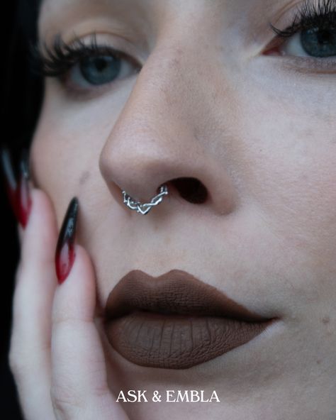 Close-up image of a woman with dark lipstick, dark red long nails, and a silver clicker: featuring the Elysian Clicker from Ask & Embla. Septum Piercing Clicker, Boho Septum Piercing, Septum Ring Aesthetic, Cool Septum Jewelry, Septum Piercing Aesthetic, Alt Jewelry, Piercings Septum, Elven Forest, Jewelry Alternative