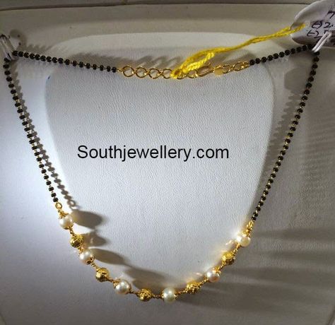 22 carat gold light weight simple black beads mangalsutra chain strung with gold balls and south sea pearls from Premraj Jewellers. Weight: 5 grams For inquiries contact on Whatsapp: +91 97 00 009000 or Email: dharmesh25@yahoo.com Related PostsBlack Beads Mangalsutra DesignsShort Black Beads ChainShort Light Weight Mangalsutra Chains5 Grams Black Beads Mangalsutra ChainsSimple Black Beads Simple Black Beads, Black Beads Mangalsutra, Black Beads Mangalsutra Design, Gold Jewelry Simple Necklace, Gold Mangalsutra Designs, Gold Necklace Indian Bridal Jewelry, Gold Mangalsutra, Beaded Necklace Designs, Long Pearl Necklaces