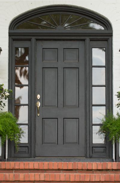 31 Houses With Black Front Entry Door Ideas | Sebring Design Build Black Front Door Entrance, Black Exterior Doors Front Entry, Black Front Doors Exterior, Black Front Door Ideas, Entry Door Ideas, Black Entry Door, White Oak Front Doors, Rustic Front Door Decor, Doors Decoration