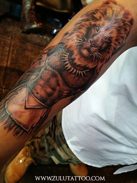 Lion of the Tribe of Judah tattoo by Zulu at Zulu Tattoo LA. Zulu Tattoo Ideas, Tribe Of Judah Tattoo, Zulu Warrior Tattoo, Zulu Tattoo, Judah Tattoo, African Warrior Tattoos, African Sleeve Tattoo, Shaka Zulu, Aa Tattoos