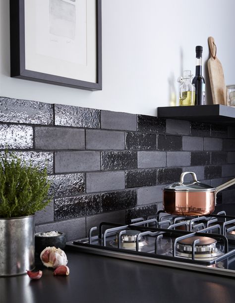 Offering a twist on the traditional brick effect tile, Aaronson Brick has a handcrafted finish which is achieved through a special manufacturing process where an extra application of clay has been added to the surface of the tile creating a unique and highly durable finish. White Kitchen Wall Tiles, Black Kitchen Design, Black Backsplash, Topps Tiles, Black Countertops, Brick Backsplash, Black Kitchen Faucets, Dark Kitchen, Kitchen Splashback