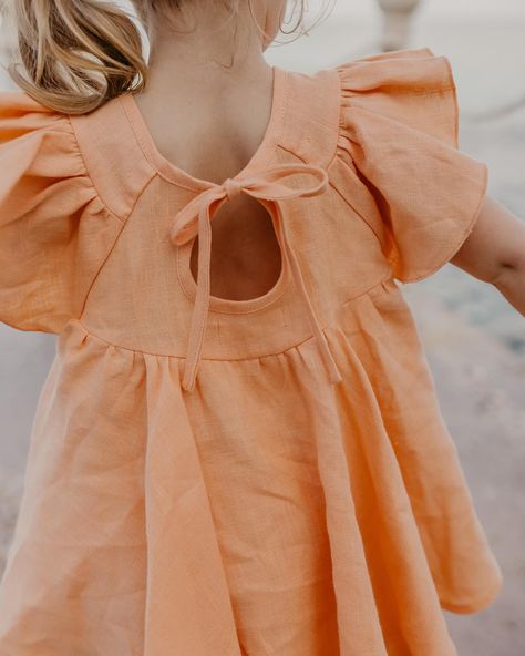 🍑 PEACH LINEN the sweetest set of Flutter Sleeve Tie Back Blouse with “Bouquet 2” embroidery and Bermuda Shorts in Peach linen 🍑 beautiful photos by @juliadukephoto Baby Top Design, Girls Linen Dress, Tie Back Blouse, Summer Embroidery, Baby Dress Design, Baby Dress Patterns, Girls Dresses Summer, April 11, Toddler Dress